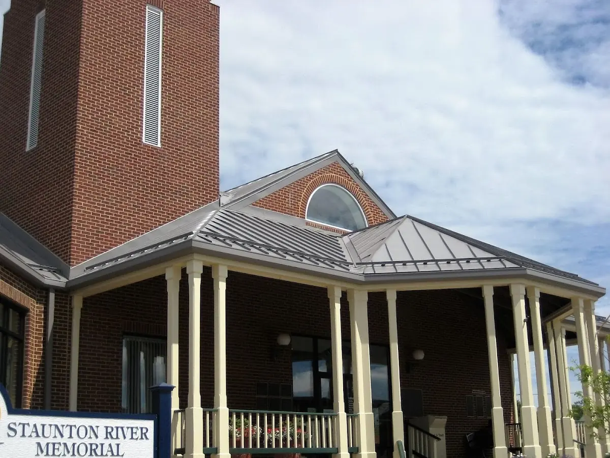 Skilled roofing craftsmen working on a residential roof in Red Bank